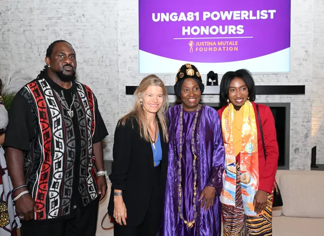 H.E. Rev. Dr. Ocansey with guests beneath the UNGA81 Powerlist Honours screen