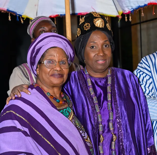 H.E. Rev. Dr. Ocansey with a fellow guest beneath the ceremonial umbrella