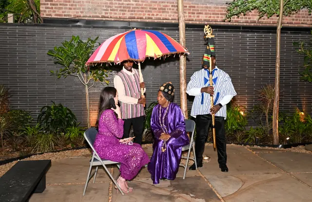 H.E. Rev. Dr. Ocansey interviewed in the garden beneath the ceremonial umbrella